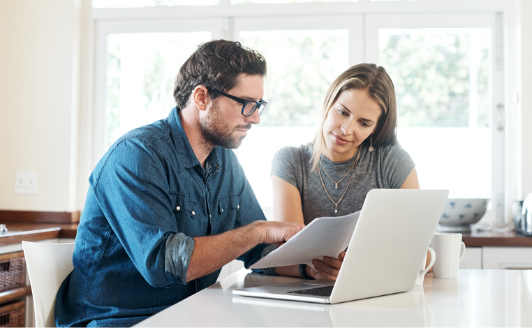 Couple working on a laptop computer